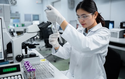 Woman researcher using a test tube.