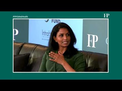 youtube poster image showing woman speaking on stage in a panel discussion